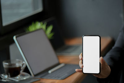 Close-up of mobile phone on table