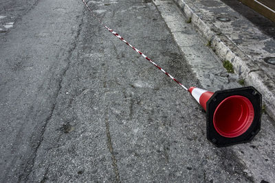 High angle view of fallen traffic cone on road