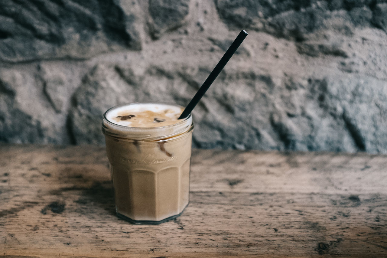 CLOSE-UP OF COFFEE IN GLASS