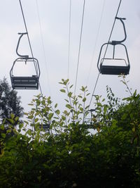 Low angle view of ski lift against sky