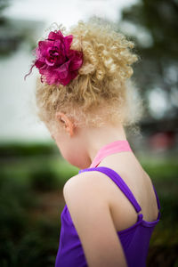Close-up of girl wearing flowers in hair