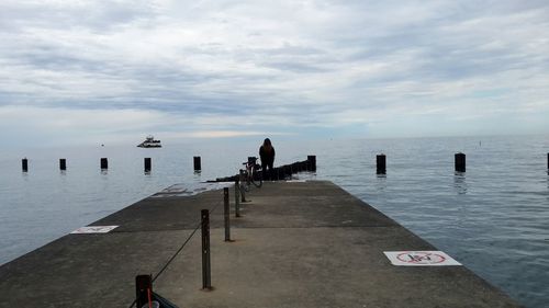 Scenic view of sea against cloudy sky