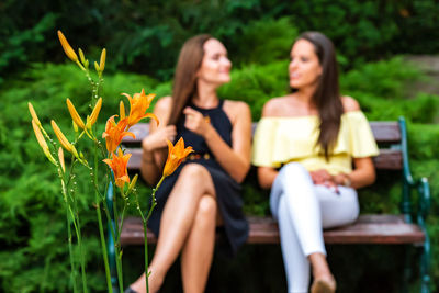 Young woman sitting outdoors