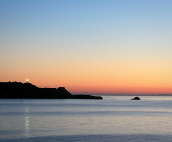 View of calm sea at sunset