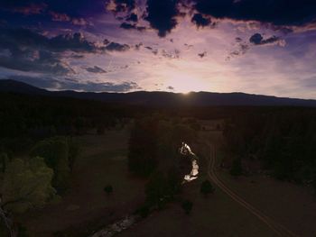 Scenic view of landscape against sky during sunset