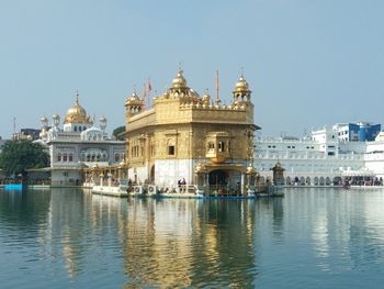 View of buildings in city against clear sky