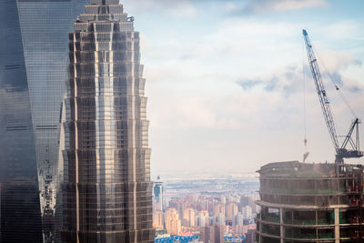 Modern buildings against sky in city