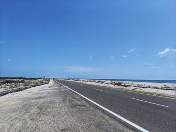 Empty road against sky