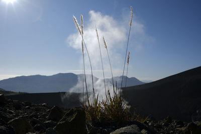 Panoramic view of land and mountains against sky