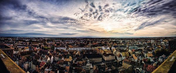 High angle view of cityscape against cloudy sky