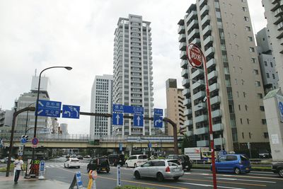 Low angle view of city street against sky