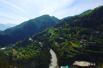 High angle view of trees and mountains against sky