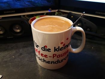 Close-up of coffee cup on table