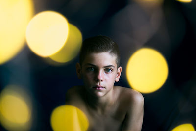 Portrait of young woman with balloons