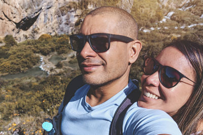 Young couple at viewpoint of the natural pools of millpu, ayacucho, peru. concept about travel