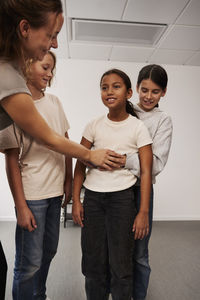 Teacher giving first aid training in case of choking