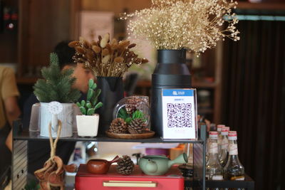 Flower vase on table at home