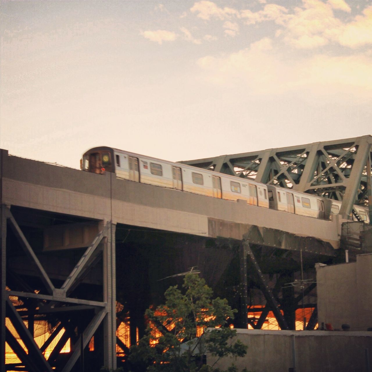 architecture, built structure, building exterior, transportation, sky, low angle view, bridge - man made structure, connection, metal, train - vehicle, abandoned, industry, day, outdoors, cloud - sky, no people, engineering, rail transportation, metallic, rusty