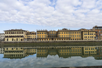  view of the buildings that flank the banks of the arno river in the city center