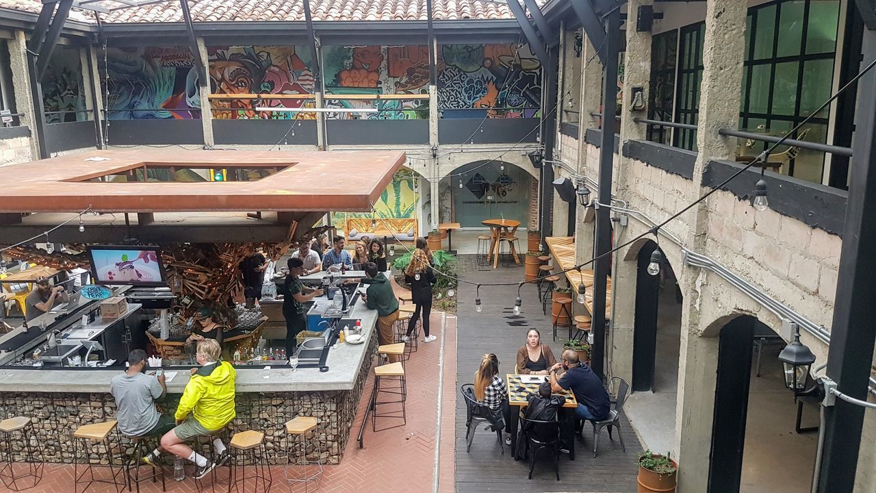 HIGH ANGLE VIEW OF PEOPLE IN MARKET