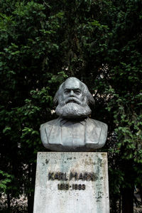 Statue against clear sky in cemetery