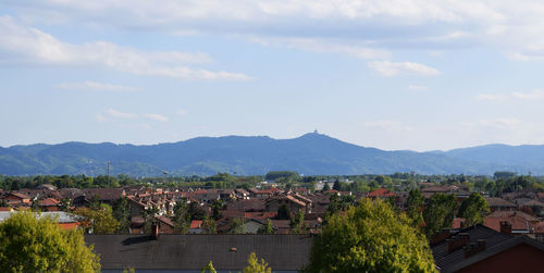 Panoramic view of trees and mountains against sky