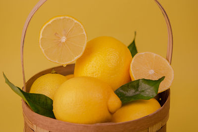 High angle view of lemons in basket