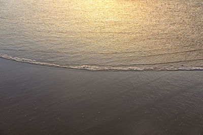 High angle view of sea shore during sunset