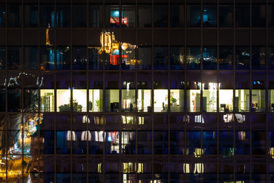 Reflection on illuminated building at night