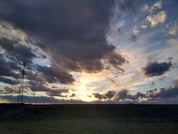 Scenic view of sunset over land