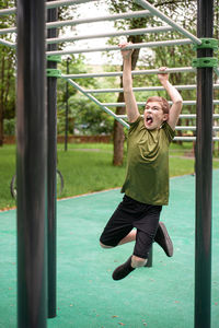 Rear view of young woman exercising in gym