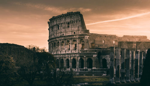 View of coliseum against sky during sunset