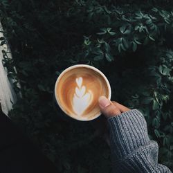 Man holding coffee cup