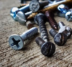 High angle view of screws on table