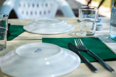 Close-up of glasses on table in restaurant