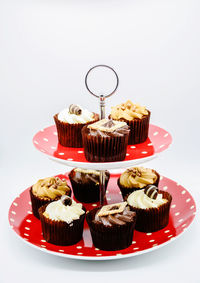 Cupcakes on plate against white background