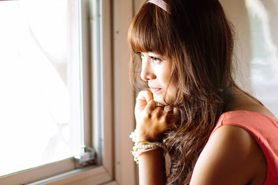 Close-up of young woman looking away