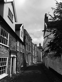 Street amidst buildings against sky