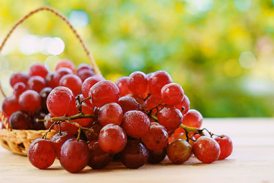 Close-up of red grapes on table