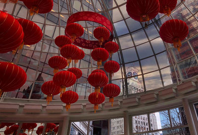 Low angle view of lanterns hanging against sky