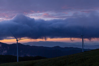 Scenic view of mountains against sky during sunrise