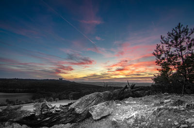 Scenic view of landscape against sky during sunset