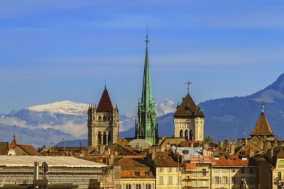Cathedral saint pierre and alps mountains in geneva, switzerland 