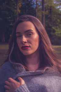 Portrait of woman wearing make-up in city