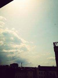 Low angle view of building against cloudy sky