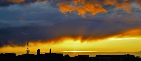 Scenic view of dramatic sky at sunset