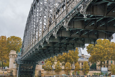 Low angle view of built structure against trees