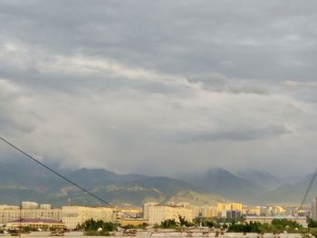 Buildings in city against sky