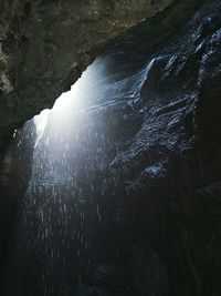 Low angle view of rock formation in water