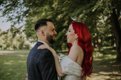 Wedding day. happy bride and groom hugging and laughing red hair diversity